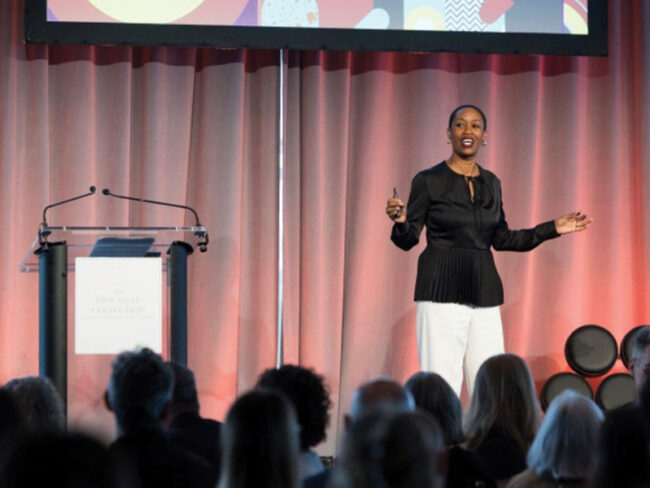 Candace Doby on stage at the IIDA -NY Leaders Breakfast