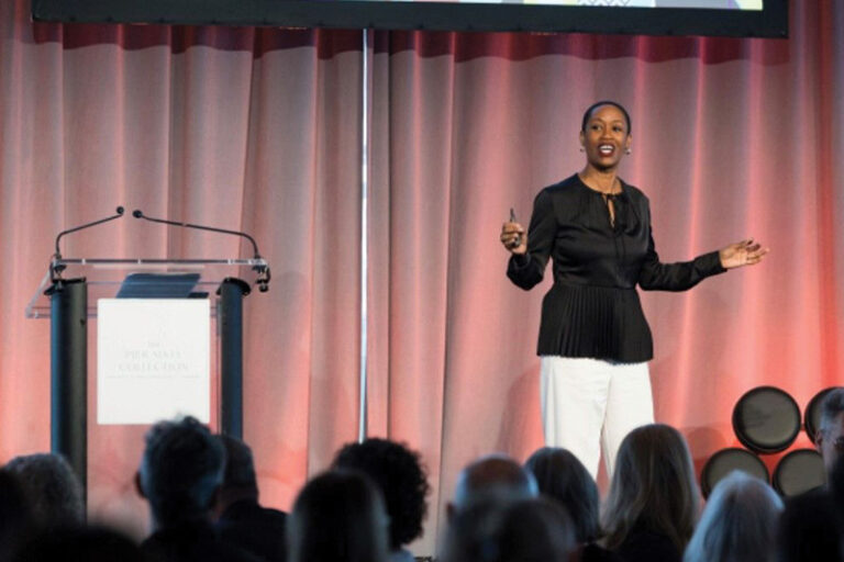Candace Doby on stage at the IIDA -NY Leaders Breakfast